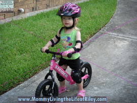 Riley riding her Strider PREbike