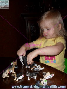 Riley Playing with Her Schleich Dog Figurines